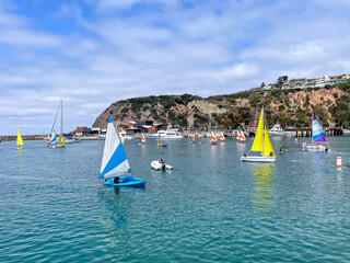 Dana Point, California, USA, July 16, 2025: Dana Point Harbor looking at sailboat in Baby Beach Cove