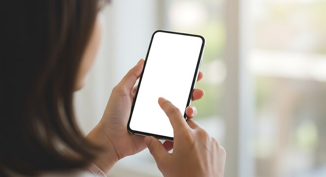 Woman hand holding using touch mobile phone white screen mockup Back view
