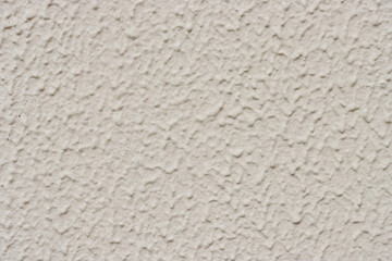 Close-up of light gray new plaster on the wall.