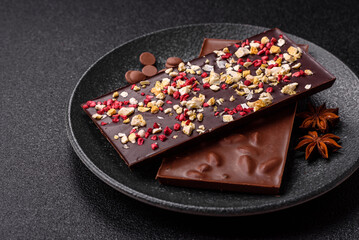 Bar sweet craft artisan chocolate with dried fruits made at home. Craft chocolate