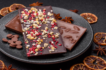 Bar sweet craft artisan chocolate with dried fruits made at home. Craft chocolate