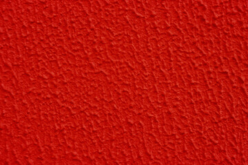Abstract background of red textured concrete wall.