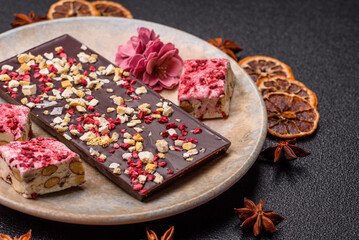 Bar sweet craft artisan chocolate with dried fruits made at home. Craft chocolate