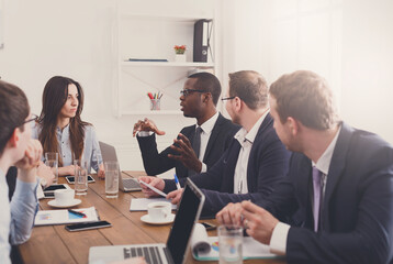 Business discussion at meeting of multiethnic team. Office strategy planning, communication with partners