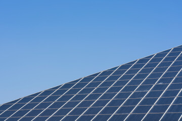 The symmetrical glass panels of an architectural structure
