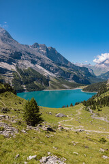 Lake Oeschinen in Switzerland, beautiful swiss mountain lake famous on Instagram
