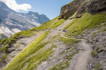 Lake Oeschinen in Switzerland, beautiful swiss mountain lake and famous hike on Instagram