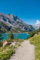 Lake Oeschinen in the Swiss Mountains near Bern. It is famous for hiking and an Instagram hot spot