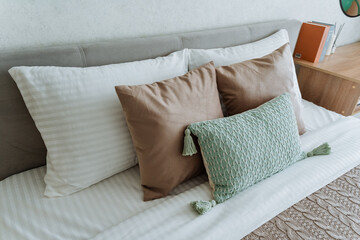 Picture a cozy bed with crisp white sheets and fluffy pillows, creating a relaxing atmosphere ideal...