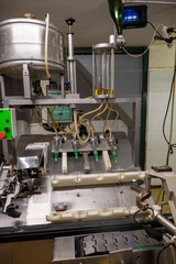 Disgorgement process with champagne bottles in caves, traditional method of production of cremant, blanquette sparkling wine Limoux, Occitania, France