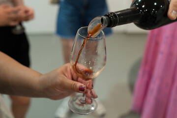 Tasting of Banyuls AOC aged natural sweet grand cru Banyuls fortified dessert wine from old vines from slopes Pyrenees in Roussillon, France made in glass jar Dame Jeanne or demijohn