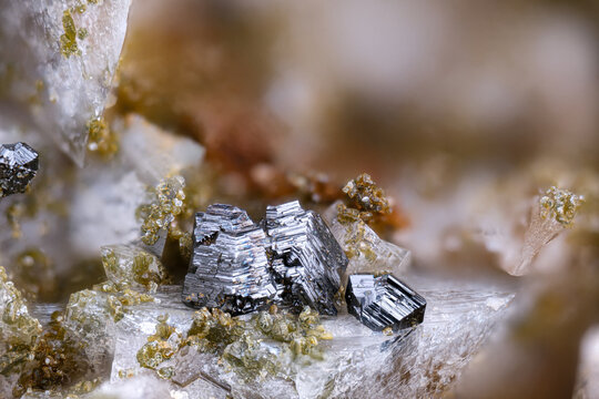 Rutile with green Clinochlore on Adularia. Specimen from Gro&szlig;e Flei&szlig; valley, Austria. Micro photography extreme close-up. microscope mineral crystal photography for Scientific use.