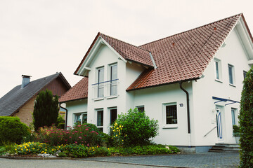 This contemporary house, elegantly situated among vibrant and lush gardens, offers a bright and inviting atmosphere that significantly enhances the overall charm and appeal of the property