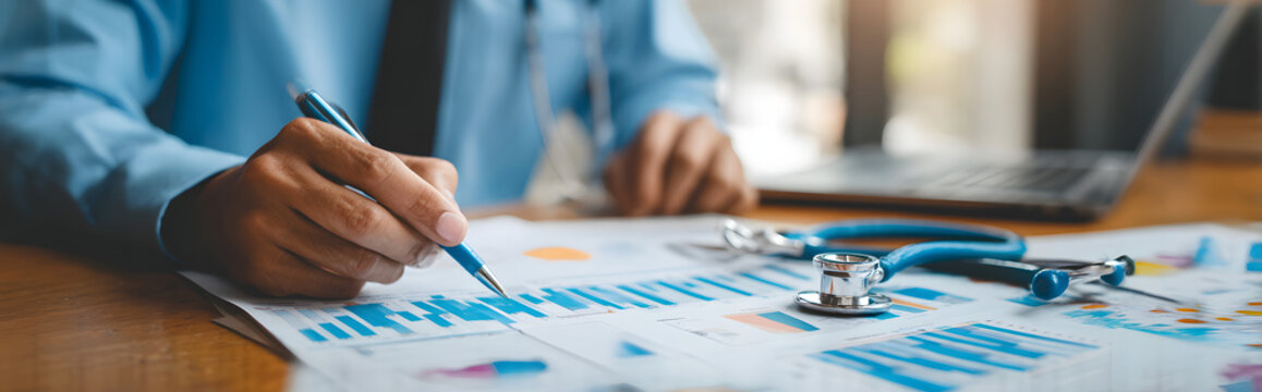 Medical business and healthcare insurance concept. Businessman analyzing growth graph data on medical business report, develop collaboration and partnership in healthcare and insurance industry. - Powered by Adobe