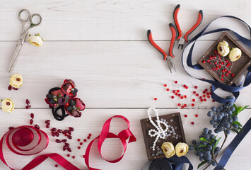 Making jewelry, home workshop background. Flat lay, tools and materials for creating accessory with...