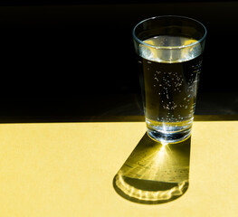 glass of fresh water in the sun