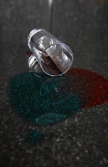 spilled red and blue liquid on table