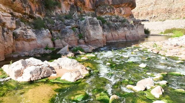 Aerial Fly Through Virgin River Gorge Dramatic Cliffs Flowing Water Arizona