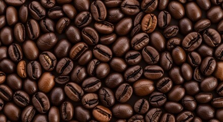 Fototapeta premium Closeup of Dark Roasted Coffee Beans on Black Background