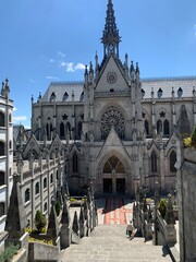 Gothic church facade under blue sky in Quito