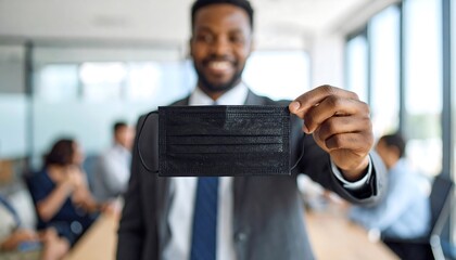 Businessperson holding a face mask