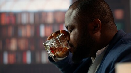 Elegant upper class gentlemen enjoying a glass of smoked whiskey in a luxurious vintage social club, showcasing the sophisticated old money lifestyle and entertainment. Close up. Camera A.