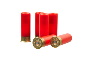 Six red 12-gauge shotgun shells, some standing and some lying down, on a white back