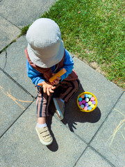 Creative Outdoor Play A Child Enjoying Arts and Crafts Activities Using Vibrant, Colorful Chalks on...