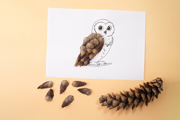 Owl illustration with pine cone scales on paper for eco education, autumn workshops, nature crafts, children DIY, art schools, creative branding and seasonal content creators,