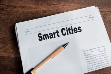 Smart cities text in headline isolated on wooden table. Newspaper concept
