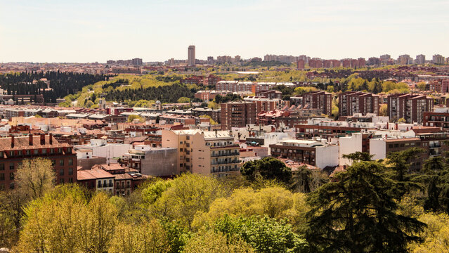 Partial view of the Casa de Campo neighborhood, Moncloa-Aravaca district and the trees of the Case de Campo park, the largest public park in the city of Madrid, Spain