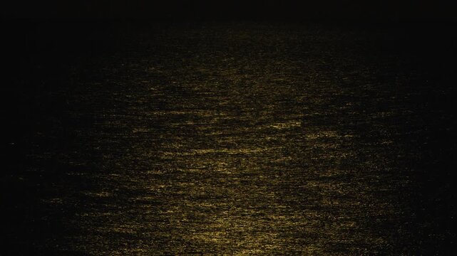 Moon Illuminates the Surface of the Ocean The Romatic and Mysterious Night