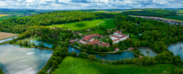 Aerial view around the castle Schloss Derneburg in Hole, Germany on a sunny spring day.