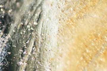 Macro texture of air bubbles on frozen ice block