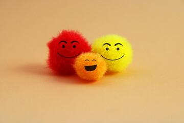 Happy couple with their son, colorful plush balls