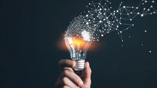 A hand holding a glowing idea bulb with a network of connections
