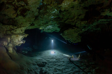 Diver exploring Dos Ojos Cenote, Mexico 