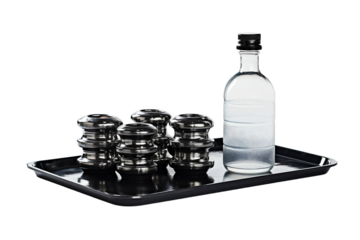 Weight plates leaning beside water bottle