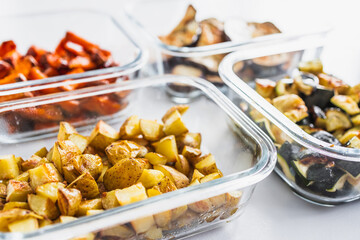 glass containers with meal prepped roasted sweet potato potato zucchini and eggplant for the week
