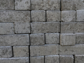 Pile of cube pavers, flooring or concrete block paving, side view