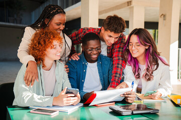 A diverse group of focused students actively collaborating on an exciting academic project with...