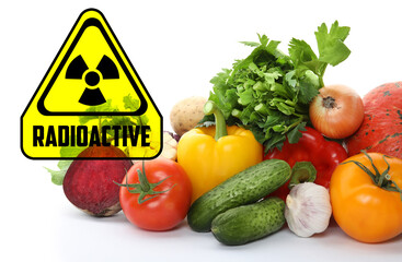 Fresh vegetables and radioactive sign on white background. Environmental contamination, polluted food