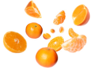 Juicy tangerines swirling in air against white background