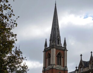 Obraz premium Church spire against cloudy sky