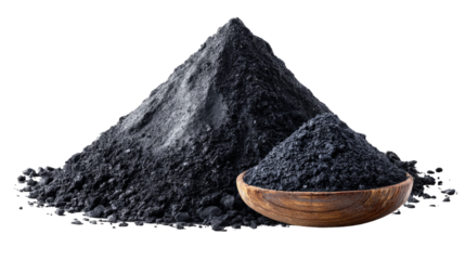 Activated Charcoal Powder: An eye-level shot shows a close-up view of activated charcoal powder piled in a dramatic heap next to a wooden bowl.