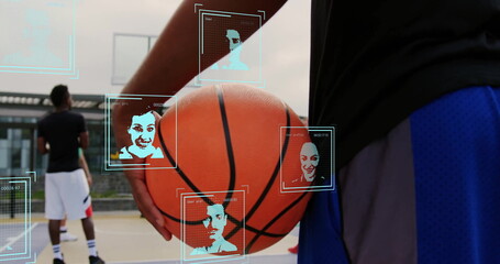 Fototapeta premium Basketball player wearing sportswear holding orange basketball on court, with digital face grids
