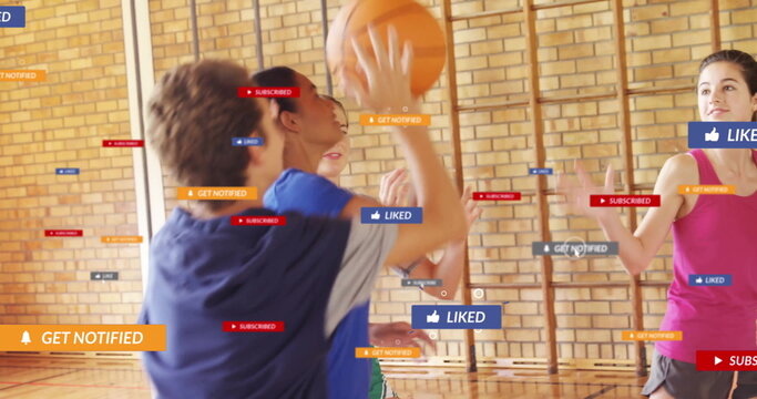 Dribbling boy in blue shirt playing basketball in school gym with notification icons, copy space
