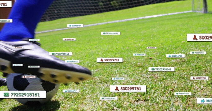 Athlete in blue jersey kicking ball on grass, with floating data tags, goal net, copy space