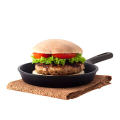 Gourmet Burger on a Cast Iron Skillet Displayed Against a Black Background