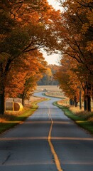 Naklejka premium Autumn road through golden trees